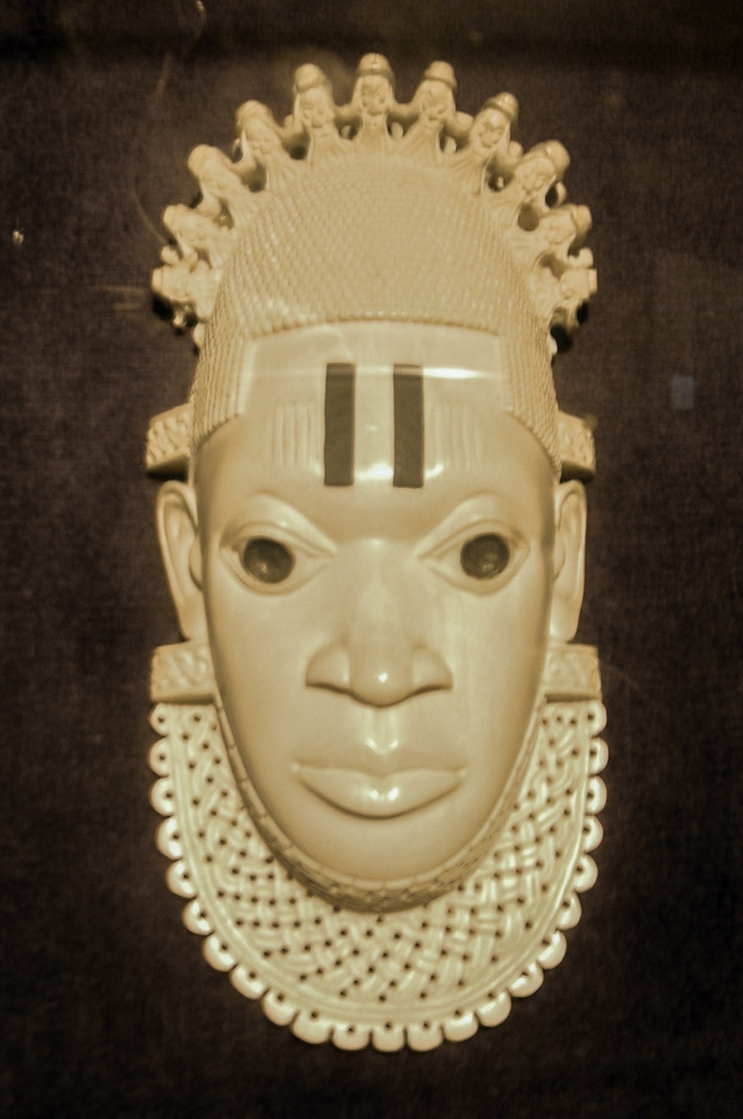 Queen Idia ivory sculpture housed in a Lagos museum — the face behind the FESTAC emblem